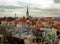 Oleviste Church View on the famous castle wall and Cathedral with Old Town towers in Tallinn, Estonia. Gothic Landmarks of