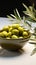 Olive bowls accented by charming olive twigs against a clean white backdrop