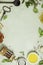 Olive oil, balsamic vinegar, salt, pepper, herbs, pasta, tomatoes on concrete background