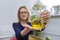 Olive oil in bottle in hand of woman nutritionist, healthy food, healthy lifestyle