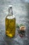 Olive oil in a bottle with rosemary and thyme inside