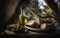 Olive oil bottle, sesame bread, olives in bowl and olive branch on rustic wooden table with olive trees in background. Generative