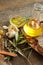 Olive oil in a bowl and carafe on vintage wooden boards.