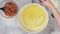 Olive oil on frying pan, close up video, flat lay, woman hands.