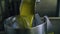 Olive oil machine working at factory closeup. Fresh product pouring in tank bin
