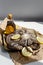 Olive oil with raw octopus on a plate with lemons ready for preparing