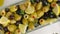 Olive salad with green and black olives and lemon, blur to focus, top view, zooming