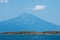 Olive tree on a small island in front of the holy mountains Athos