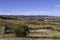 Olive trees and almond trees fill the rolling farmlands in barranco Hondo in Gojar, Andalusia. A village in the hills of Granada.