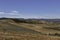 Olive trees and almond trees fill the rolling farmlands in barranco Hondo in Gojar, Andalusia. A village in the hills of Granada.