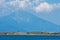 Olive trees on a small island in front of the holy mountains Athos