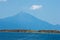 Olive trees on a small island in front of the holy mountains Athos