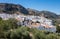 Olive trees surround hilltown of Zuheros in Andalucia