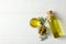 Olives, bottle and bowl with olive oil on background, top view