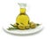 Olives and jar of olive oil on white
