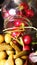 Olives, pickles and radishes coming out of a glass jar