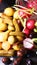 Olives, pickles and radishes coming out of a glass jar