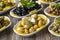 Olives. Varieties of olives on wood background. Healthy food. Selective focus olive