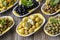 Olives. Varieties of olives on wood background. Healthy food. Selective focus olive