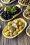 Olives. Varieties of olives on wood background. Healthy food. Selective focus olive