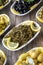 Olives. Varieties of olives on wood background. Healthy food. Selective focus olive