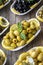 Olives. Varieties of olives on wood background. Healthy food. Selective focus olive