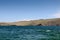 Olkhon Island coast with ferry port. Lake Baikal. View from the water