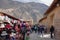 Ollantaytambo/Peru - Oct.02.19: touristic area of the historic city, craft stores and mountains on the back