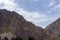 Ollantaytambo ruins, a massive Inca fortress with large stone terraces on a hillside, tourist destination in Peru