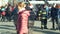 Olomouc, Czech Republic, February 29, 2019: Fire flames logs and wood with traditional iron crucible barrel, people walk