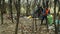 OLOMOUC, CZECH REPUBLIC, JANUARY 2, 2019: Man collect garbage and rubbish gathers bag, forest landscape, black dump of