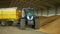 OLOMOUC, CZECH REPUBLIC, JUNE 11, 2019: Tractor New Holland T 7060 and siding Bednar Wagon utilization transportation of