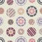 Ð¡olorful circles with striped elements inside on a calm beige background. Seamless geometry abstract pattern.