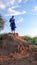 Olpopongi, Kilimanjaro Province / Tanzania: 29. December 2015: young Tanzania Masai warrior in traditional clothing digs in a