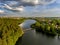 Olsztyn Lake Dlugie, bird`s eye view. Wooded shores, the sky reflecting in the water table and a bridge over the lake - Warmia and