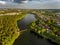 Olsztyn Lake Dlugie, bird`s eye view. Wooded shores, the sky reflecting in the water table and a bridge over the lake - Warmia and