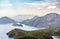 Oludeniz landscape with a floating paraglider in the sky, view from the mountain at sunset