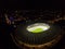 Olympic Stadium without people. Panoramic view of city with lights and stadium from above. Night time. Stadium before the game