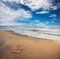 Om symbol on the beach