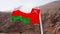 Oman flag back of a boat on sea. Musandam peninsula, Sultanate of Oman