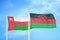Oman and Malawi two flags on flagpoles and blue sky