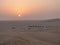 Oman, Salalah, seen from above by a sand dune in the deserted camp at sunset