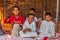 Omani children in a shade shelter