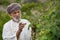 Omani man picking roses