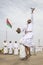 Omani man throwing a sword in a air to demonstrate his skill