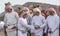 Omani men with their camels in a countryside