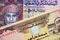 An Omani one Rial bank note with a United Arab Emirates five dirham bill