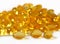 Omega-3 fish fat oil capsules close up on a white