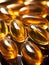 Omega 3 oil pills extreme close-up, vertical image. Omega 3 vitamin in capsules. Shiny Fish Oil Pills for Omega-3, Dietary
