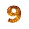 Omega vitamins supplement. Number nine made of fish oil pills and paper cut in shape of ninth numeral on white